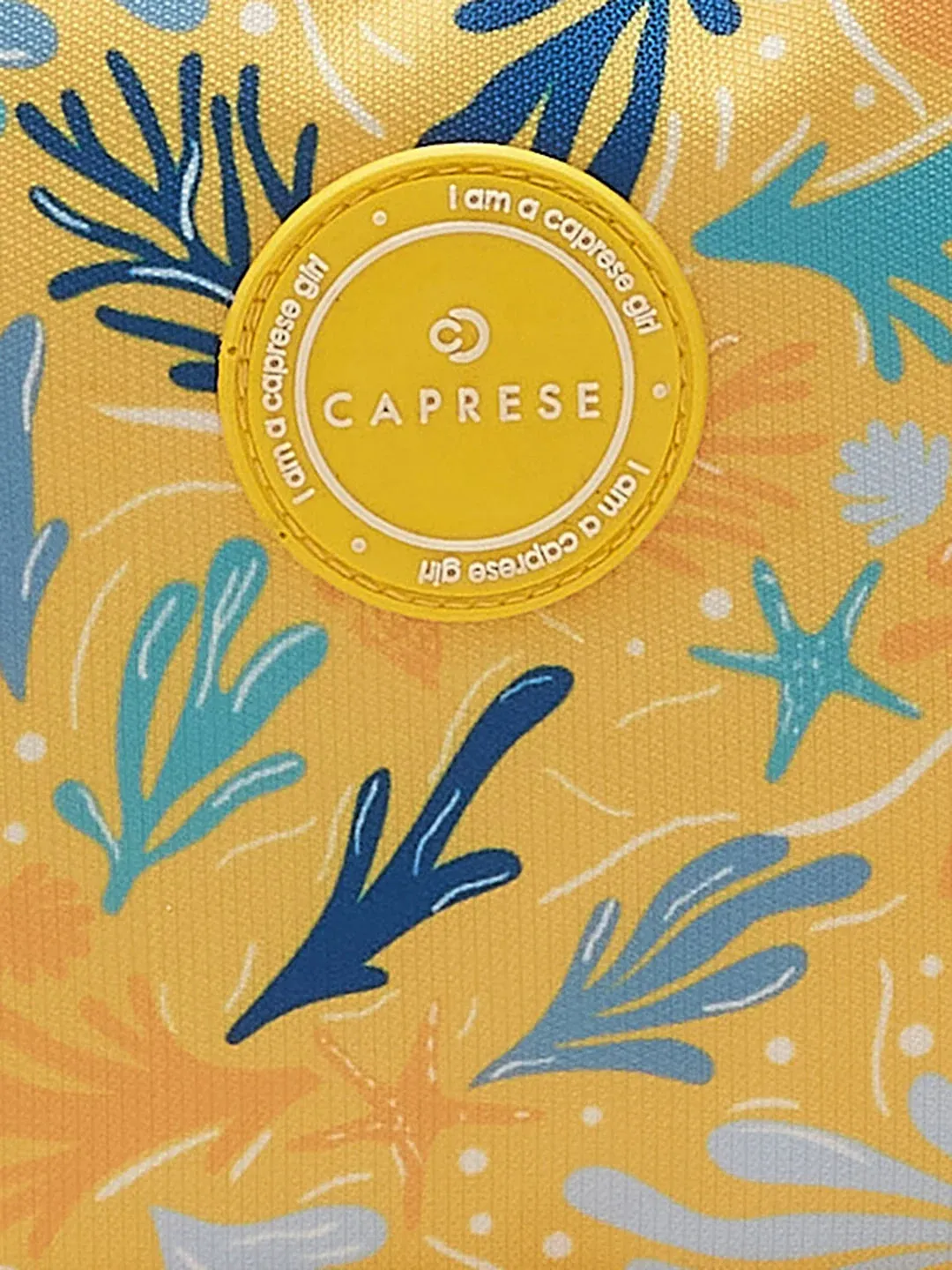 Caprese Xenia Medium Yellow Printed Backpack