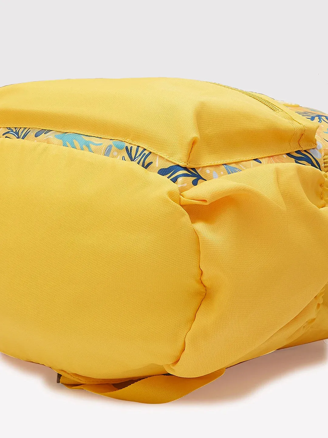 Caprese Xenia Medium Yellow Printed Backpack
