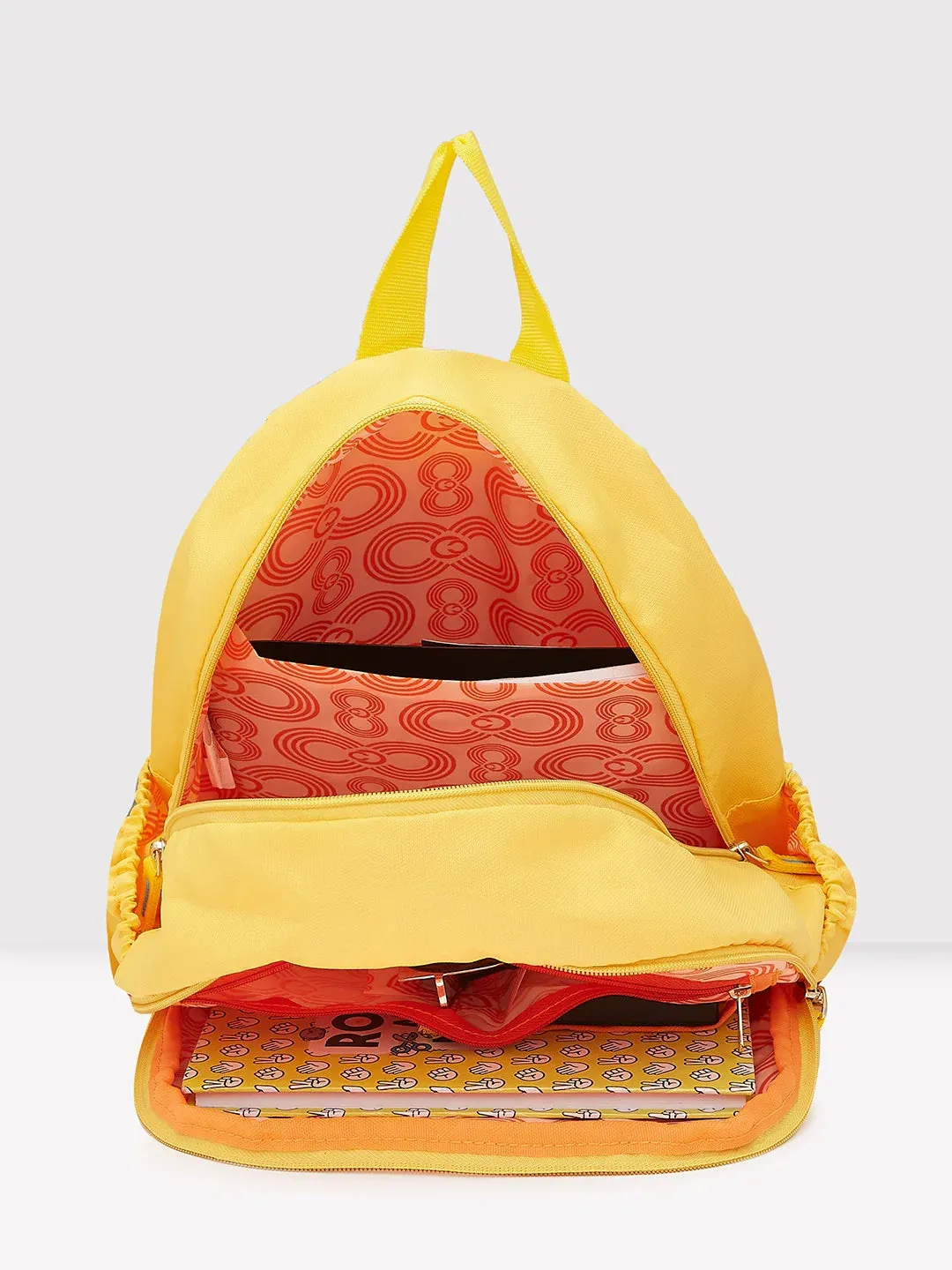 Caprese Xenia Medium Yellow Printed Backpack